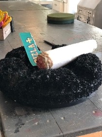 Cigarette in ashtray